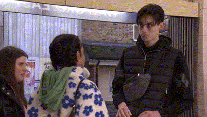 On spotting two police officers coming down the stairs from the other side of the station concourse, the boy then rapidly makes his exit from Avani and the girls, dropping the wallet on the floor in the process.